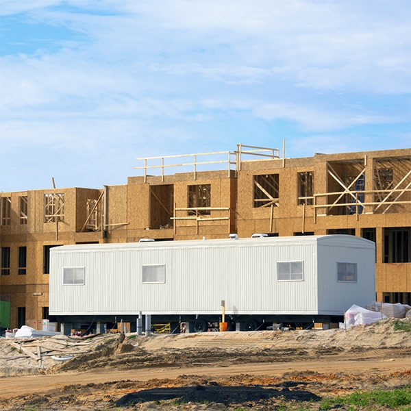 construction site office trailers can be easily moved using a truck and crane to relocate to a different construction site